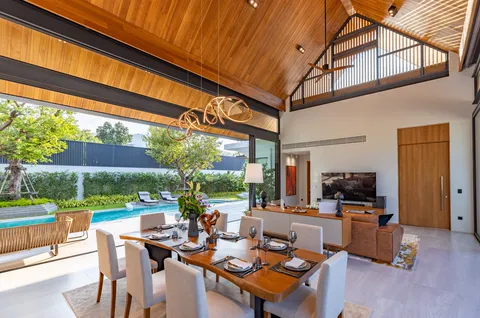 AVANA villa: dining table opening to the pool