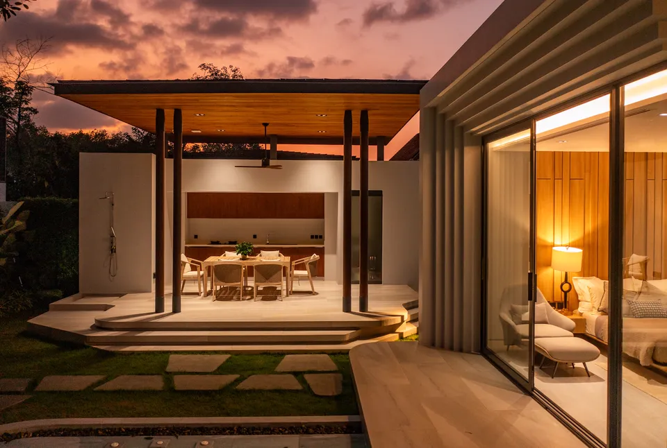 AVANA villa: outdoor pavilion and bedroom at dusk